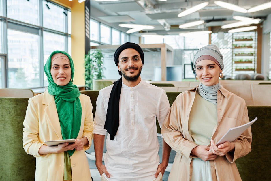 Group of diverse people in a modern office looking engaged