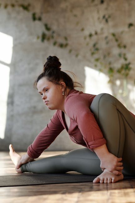 Woman meditating peacefully in a yoga pose in a beautifully lit room
